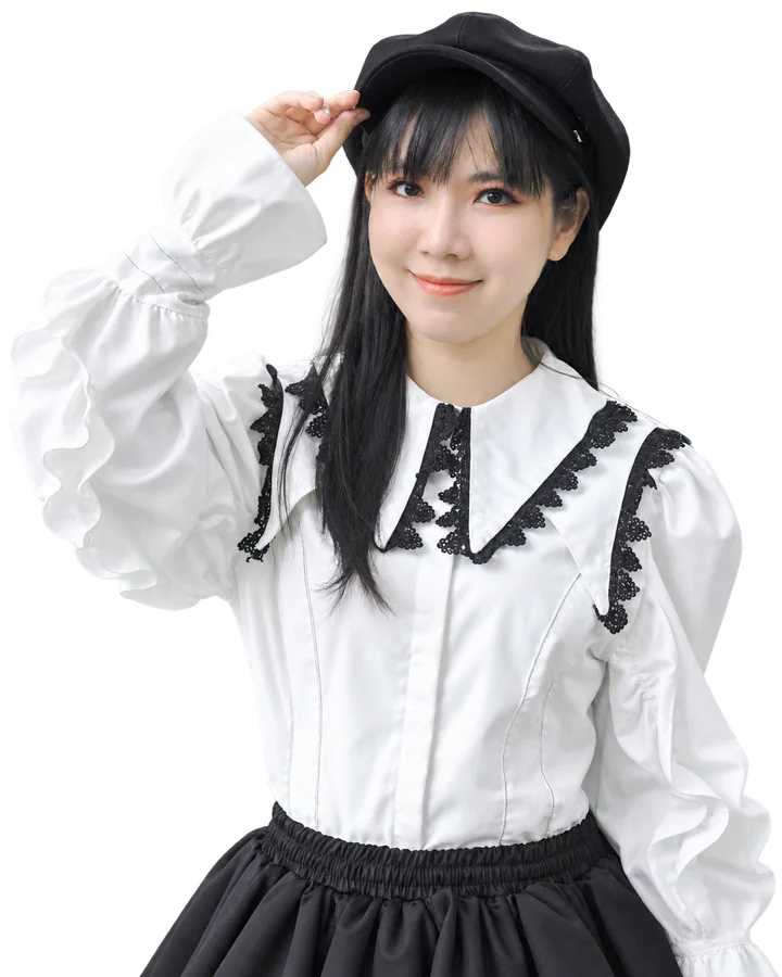 BAO NGOC LE CHAU in a white blouse and black hat