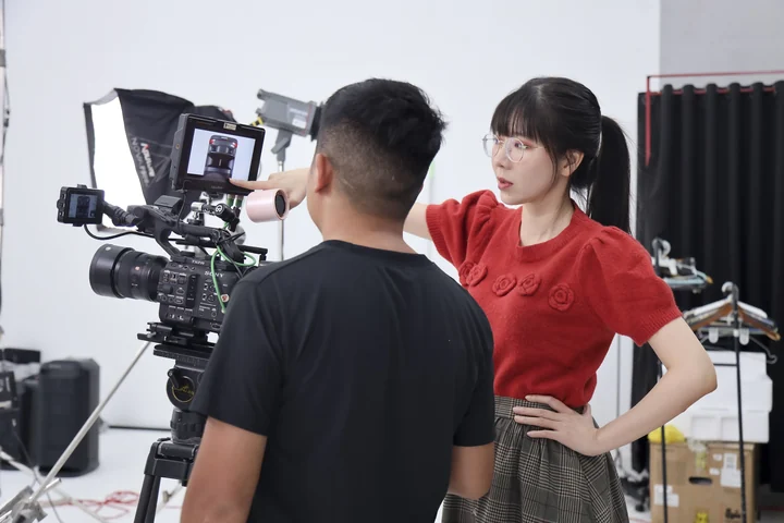 Christy in conversation with a camera operator on the Sony ULT set